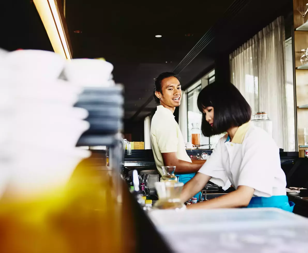 male and female bar tending.
